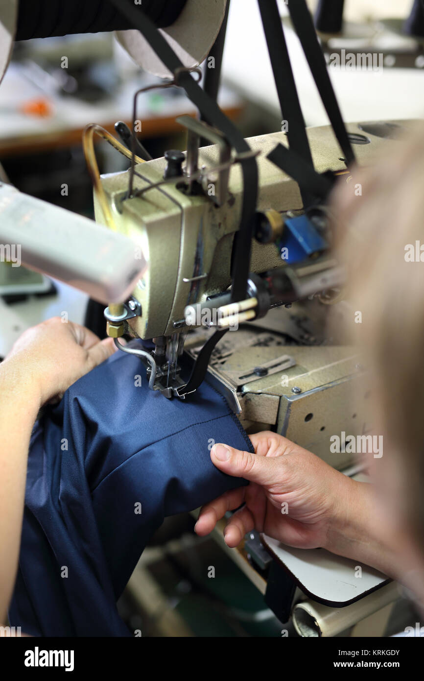 clothing production,sewing on a machine Stock Photo Alamy