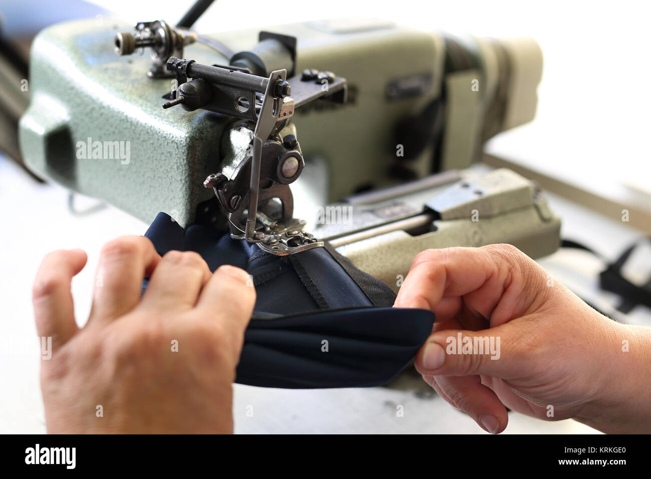 production of clothing,sewing machine overlock Stock Photo Alamy