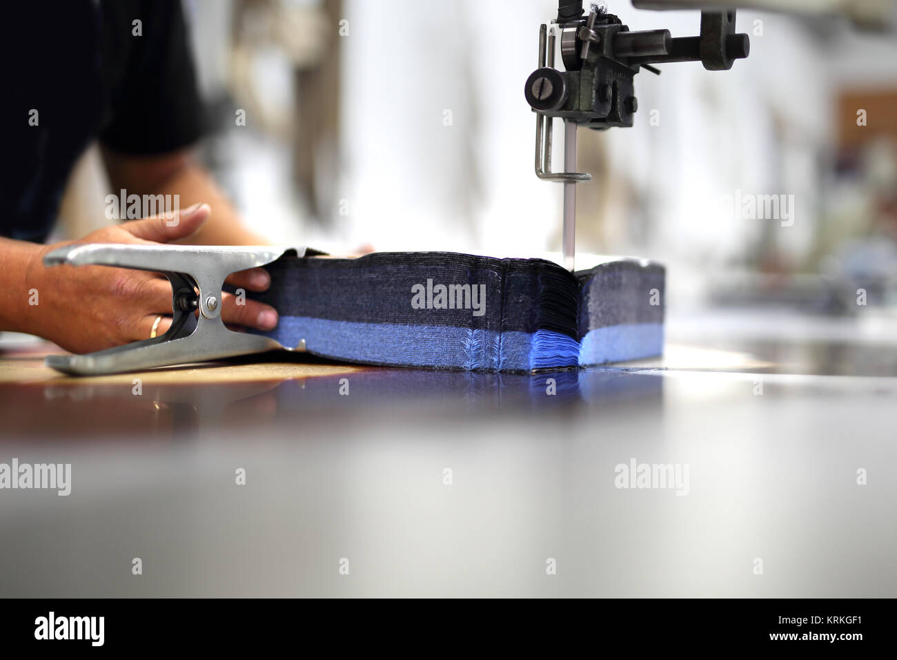 cutting the fabric,working in the sewing room Stock Photo - Alamy