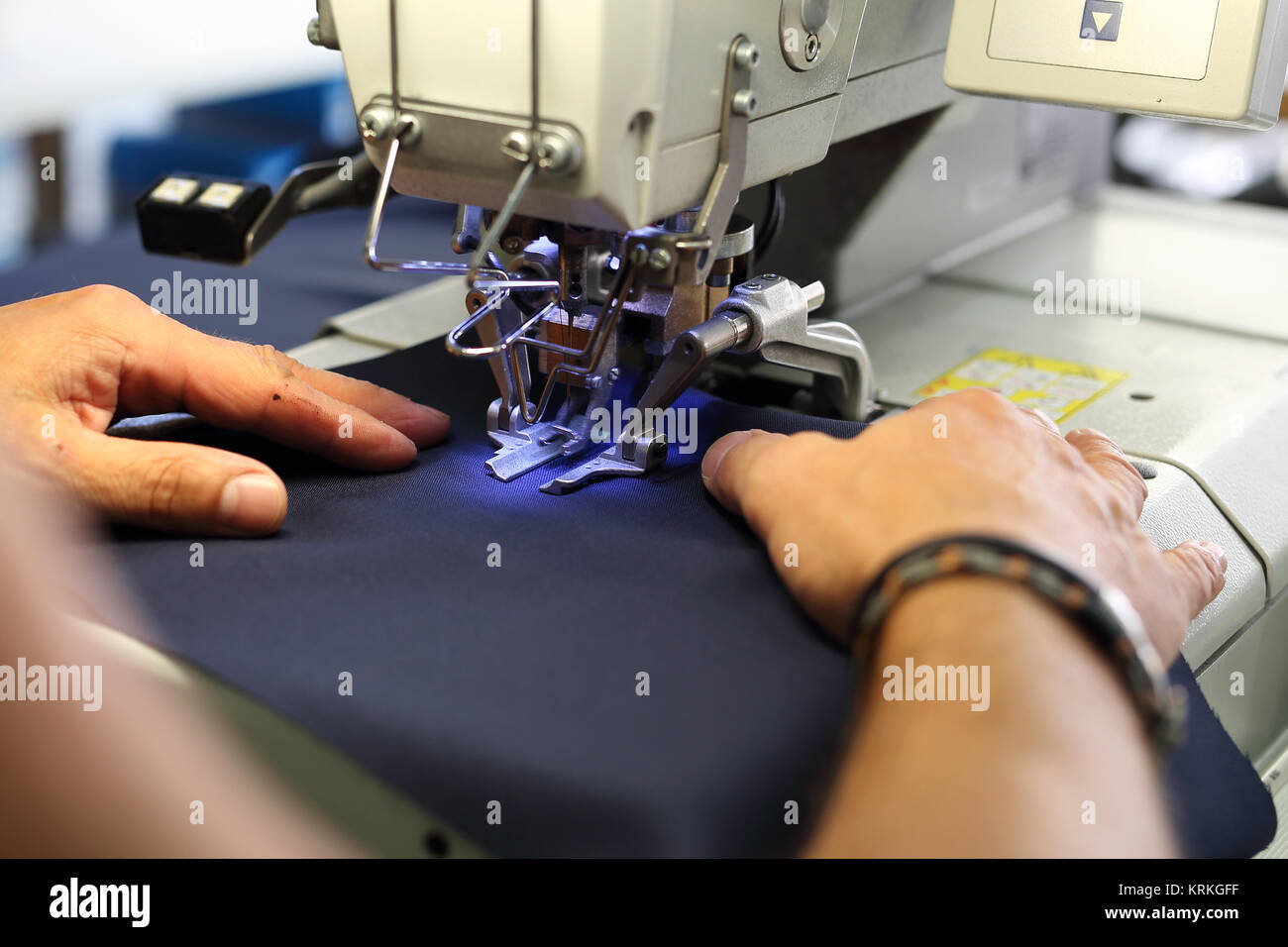 production of clothing,sewing machine overlock Stock Photo Alamy