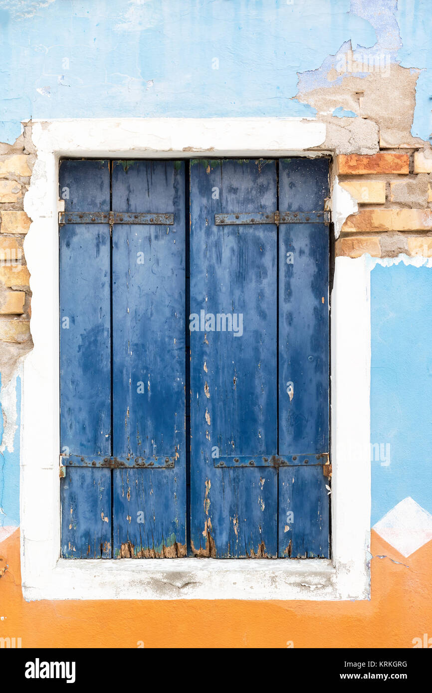 The old window with closed blue wooden shutter. Vertically Stock Photo ...