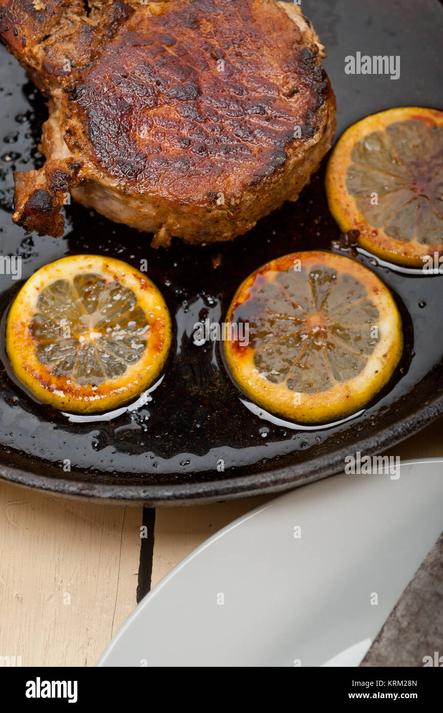 pork chop seared on iron skillet Stock Photo Alamy