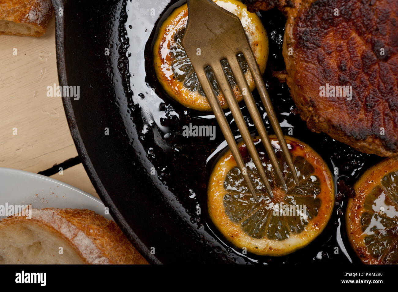 pork chop seared on iron skillet Stock Photo Alamy