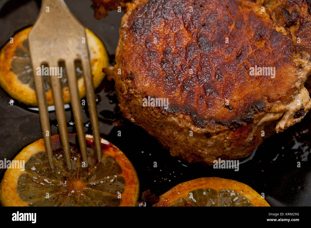 pork chop seared on iron skillet Stock Photo Alamy