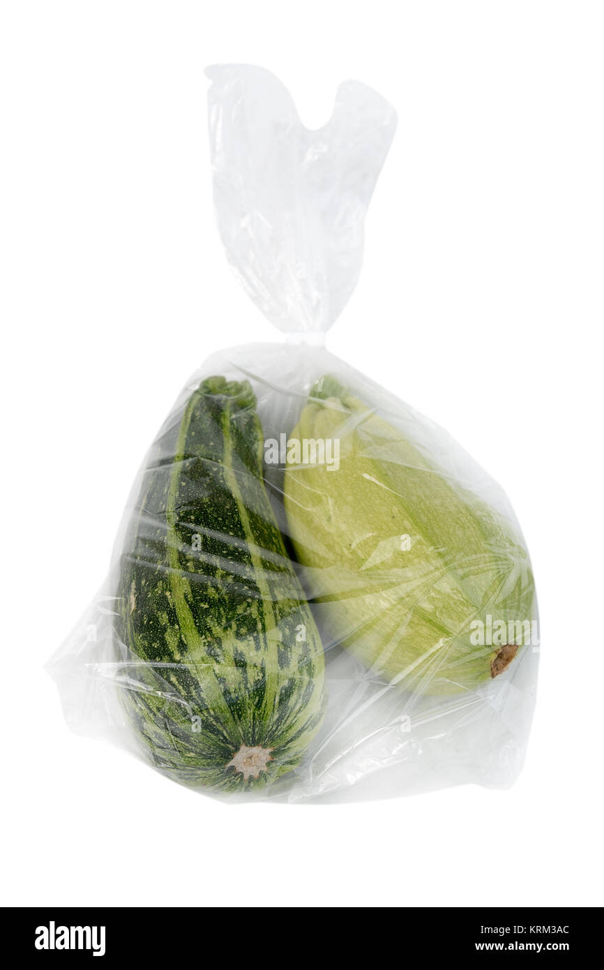 Courgettes in plastic bag isolated on white Stock Photo - Alamy
