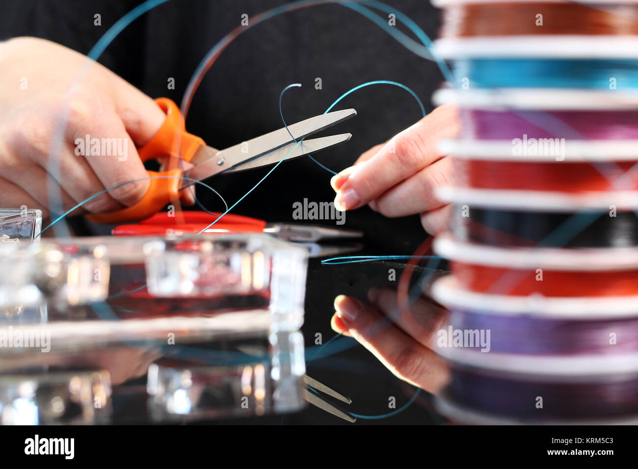 Threading beads hires stock photography and images Alamy