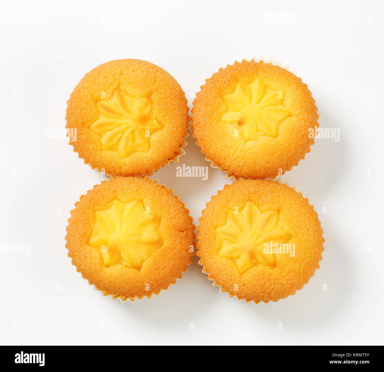 Pudding filled lemon cupcakes Stock Photo Alamy