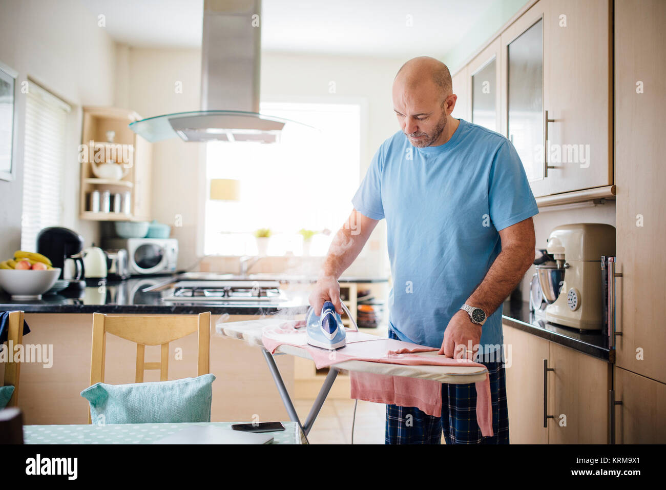 Man Ironing Laundry Stock Photo Alamy