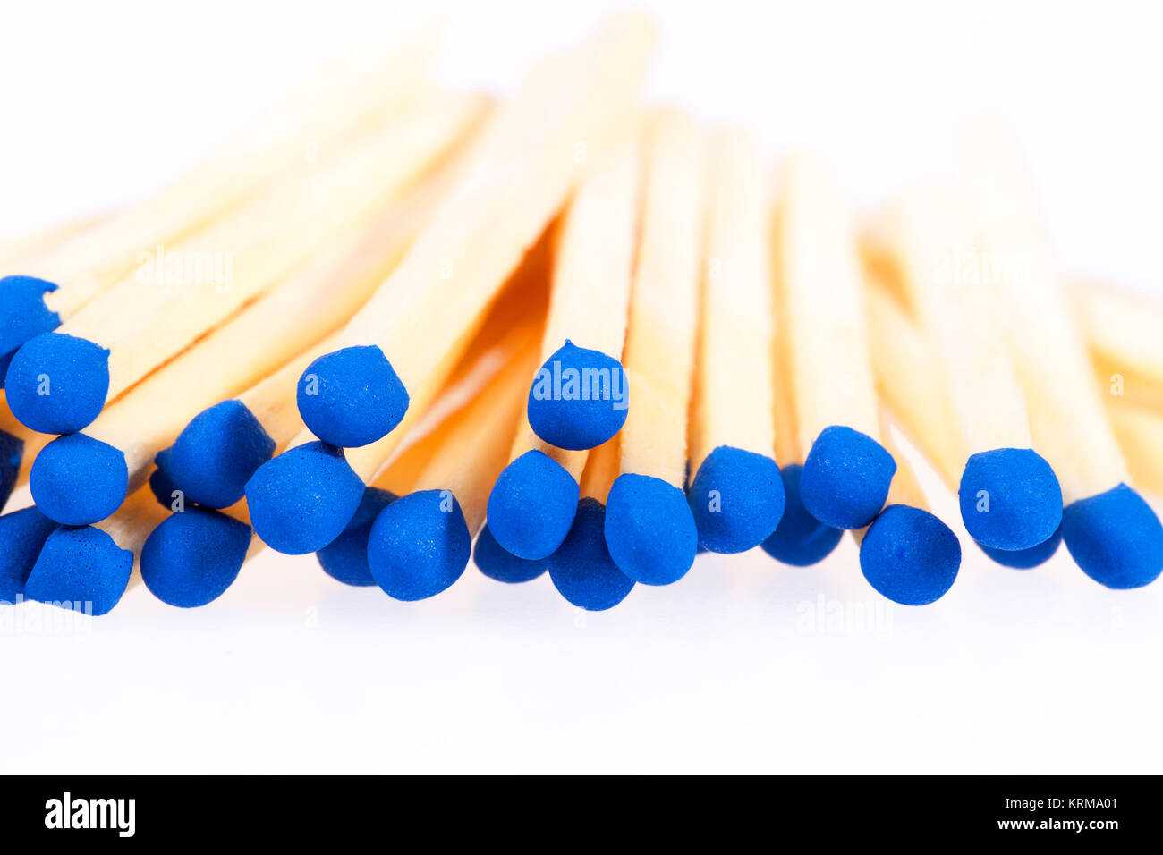 Heap of matches with blue heads isolated on white background Stock Photo