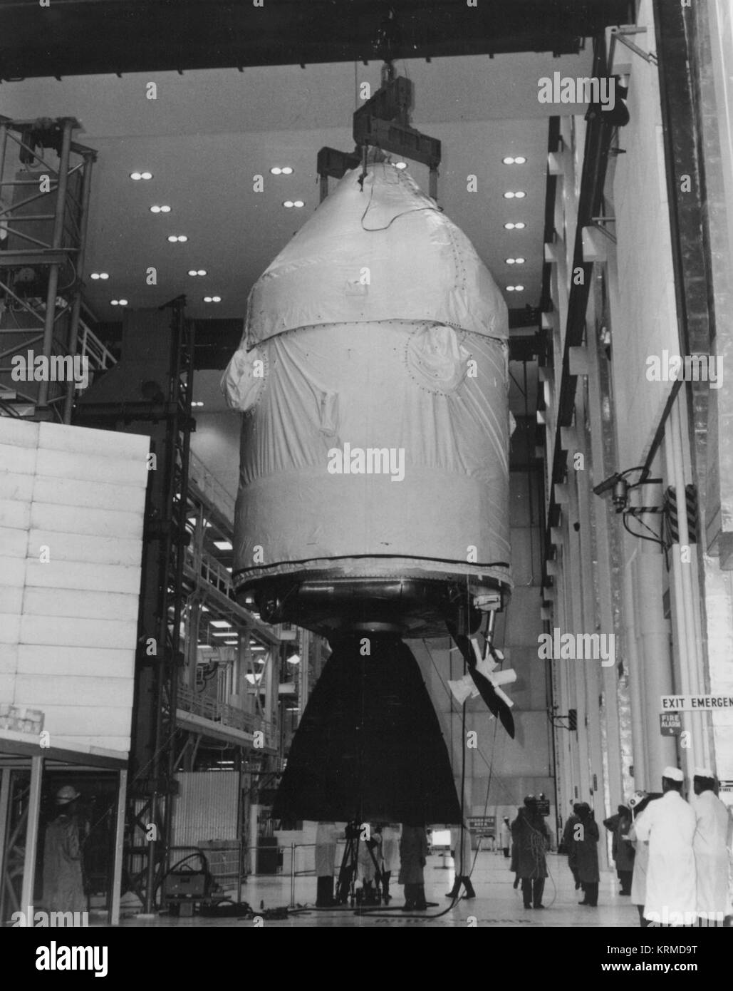 Apollo 12 command and service modules hoisted above test stand Stock Photo