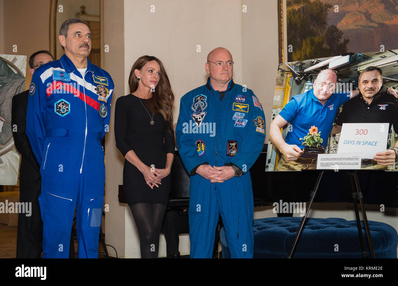 Russian cosmonaut Mikhail Kornienko of Roscosmos, left, and NASA astronaut Scott Kelly, right, are seen next to a photo of them aboard the International Space Station, at an event celebrating the strength and stability of the space station’s international partnership, Thursday, March 24, 2016, at the Spaso house in Moscow, Russia. Mariella Tefft, wife of U.S. Ambassador John Tefft, hosted the event that was attended by Head of Roscosmos, Igor Komarov, NASA Administrator Charles Bolden, and other leadership. Photo Credit: (NASA/AubreyGemignani) Spaso House Reception for International Space Stat Stock Photo