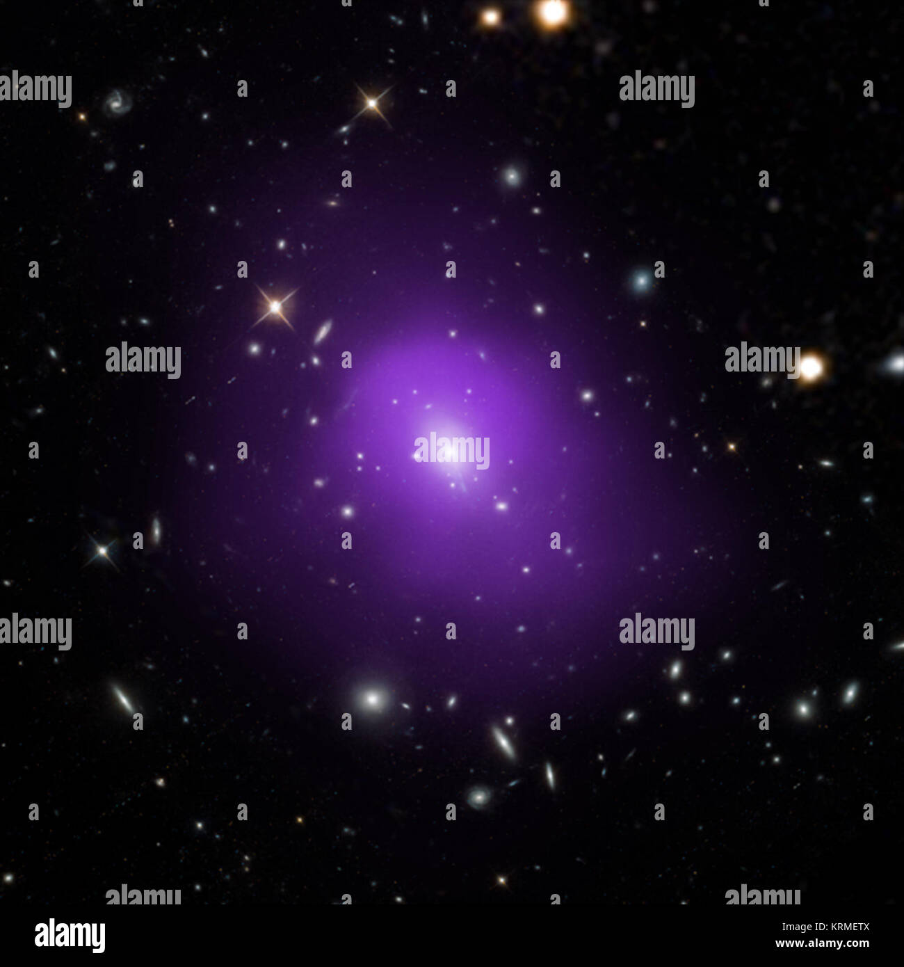 These four galaxy clusters were part of a large survey of over 300 clusters used to investigate dark energy, the mysterious energy that is currently driving the accelerating expansion of the Universe. In these composite images, X-rays from Chandra (purple) have been combined with optical light from Hubble and Sloan Digital Sky Survey (red, green, and blue). Researchers used a novel technique that takes advantage of the observation that the outer reaches of galaxy clusters, the largest structures in the universe held together by gravity, show similarity in their X-ray emission profiles and size Stock Photo