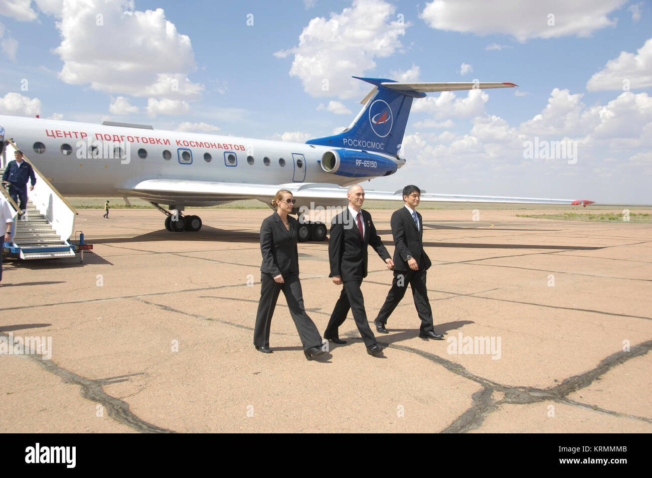 ISS Expedition 48-49 prime crewmembers Kate Rubins of NASA (left), Anatoly Ivanishin of Roscosmos (center) and Takuya Onishi of the Japan Aerospace Exploration Agency (right) arrive in Baikonur, Kazakhstan June 24 for final pre-launch training after flying from Star City, Russia. The trio will launch July 7 from the Baikonur Cosmodrome in Kazakhstan on the Soyuz MS-01 spacecraft for a planned four-month mission on the International Space Station.  NASA/Alexander Vysotsky Soyuz MS-01 crew at the airport in Baikonur Stock Photo