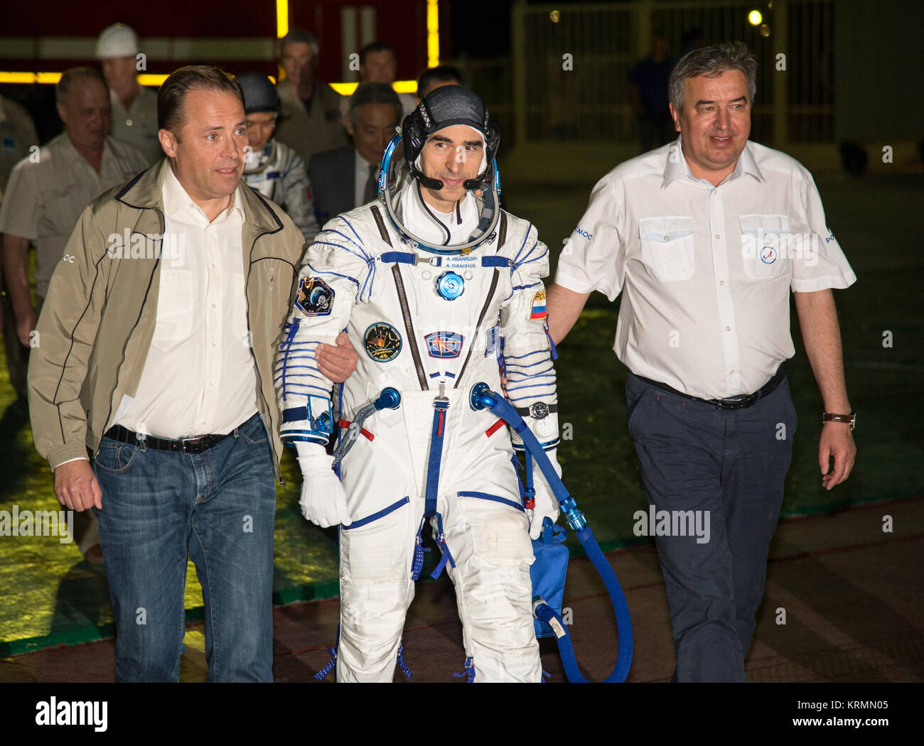 Igor Komarov, Director General of Roscosmos, left, and  Alexander Ivanov, First Deputy Director General, walk with Russian cosmonaut Anatoly Ivanishin of Roscosmos as he prepares to board the Soyuz MS-01 spacecraft with Japanese astronaut Takuya Onishi of the Japan Aerospace Exploration Agency (JAXA), and NASA astronaut Kate Rubins, Thursday, July 7, 2016 at the Baikonur Cosmodrome in Kazakhstan. Rubins, Ivanishin, and Onishi launched from the Baikonur Cosmodrome in Kazakhstan the morning of July 7, Kazakh time (July 6 Eastern time.) All three will spend approximately four months on the orbita Stock Photo