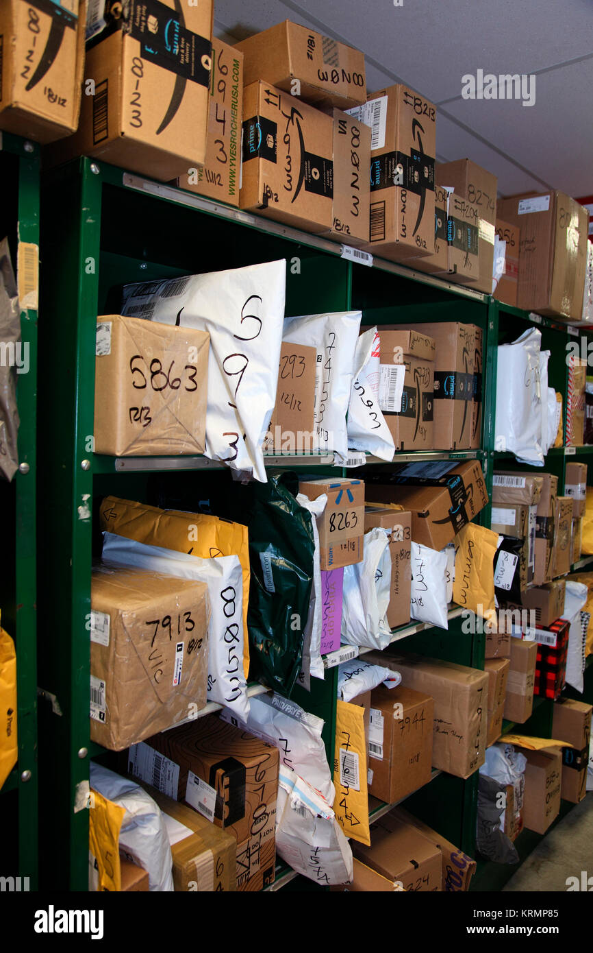 shelves filled with online parcels Stock Photo