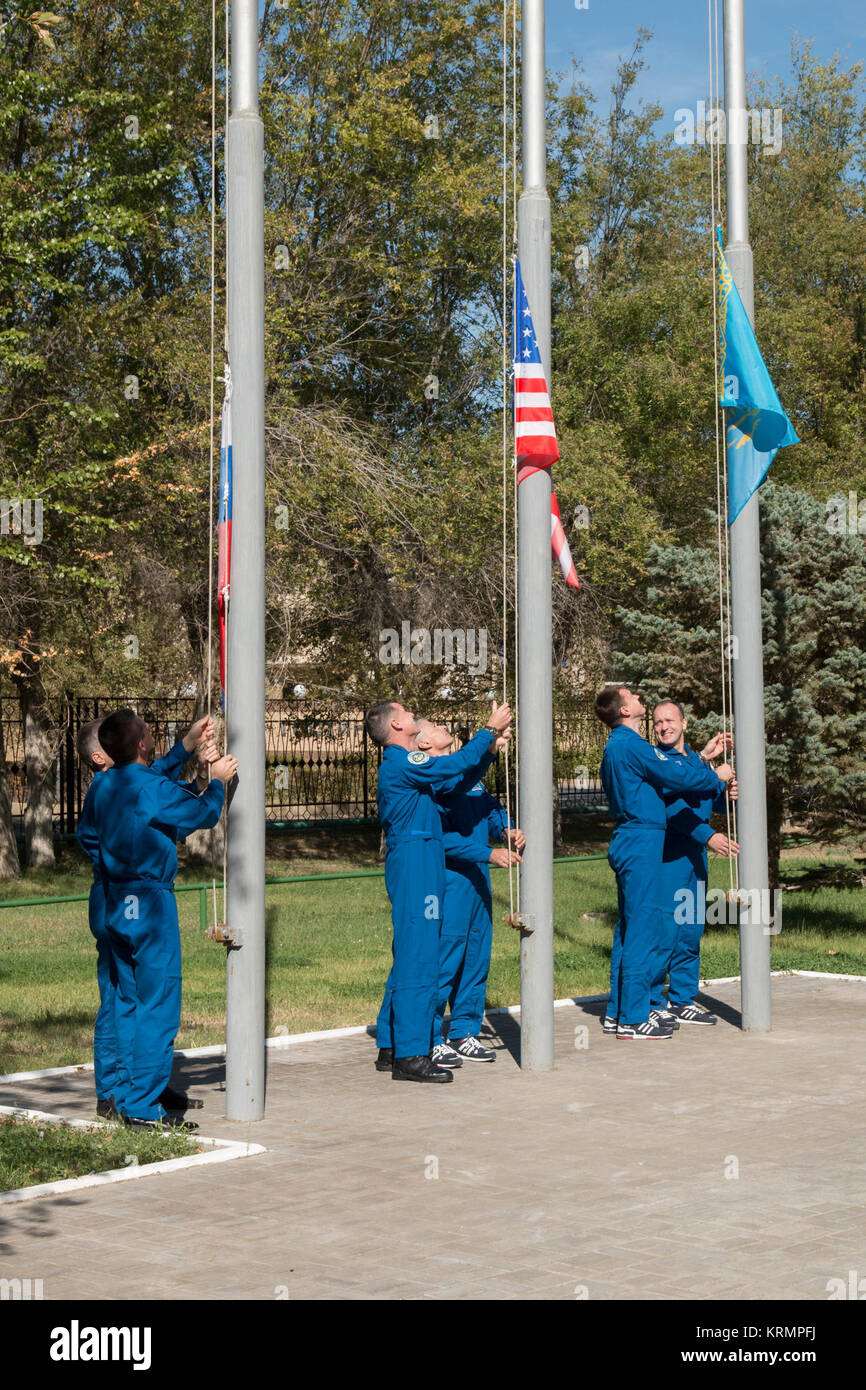 At their Cosmonaut Hotel crew quarters in Baikonur, Kazakhstan, the Expedition 49 prime and backup crewmembers participate in a traditional ceremony Sept. 10 to raise the flags of the U.S., Russia and Kazakhstan. Shane Kimbrough of NASA and Sergey Ryzhikov and Andrey Borisenko of Roscosmos will launch on Sept. 24, Kazakh time from the Baikonur Cosmodrome in Kazakhstan on the Soyuz MS-02 vehicle for a five-month mission on the International Space Station.  NASA/Victor Zelentsov Soyuz MS-02 crew and backup crewmembers conduct the traditional raising of the flags Stock Photo