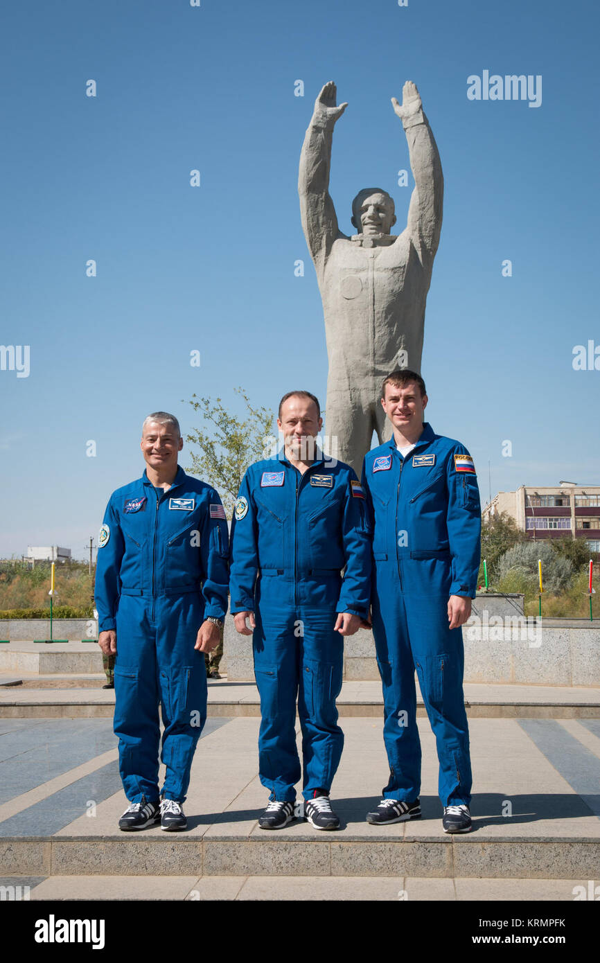 The Expedition 49 backup crewmembers pose for pictures Sept. 10 in front of a statue of Yuri Gagarin, the first human to fly in space, during a tour of the city of Baikonur, Kazakhstan. They are serving as backups to Shane Kimbrough of NASA and Sergey Ryzhikov and Andrey Borisenko of Roscosmos, who will launch on Sept. 24, Kazakh time from the Baikonur Cosmodrome in Kazakhstan on the Soyuz MS-02 vehicle for a five-month mission on the International Space Station.  NASA/Victor Zelentsov Soyuz MS-02 backup crew in front of a statue of Yuri Gagarin Stock Photo