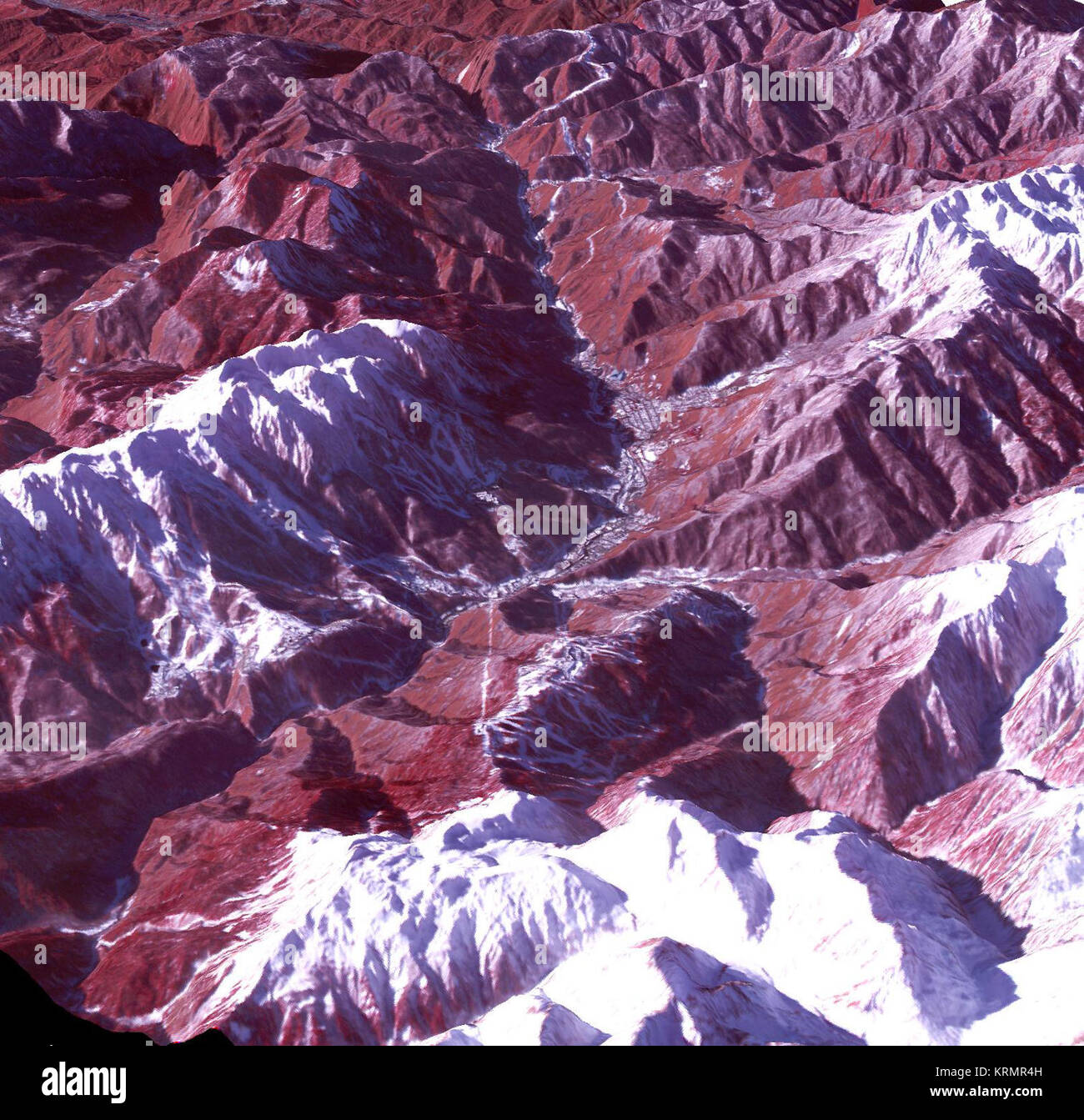 Sochi, Russia Winter Olympic Sites (Mountain Cluster)  The 2014 Winter Olympic ski runs may be rated double black diamond, but they're not quite as steep as they appear in this image of the skiing and snowboarding sites for the Sochi Winter Olympic Games, acquired on Jan. 4, 2014, by the Advanced Spaceborne Thermal Emission and Reflection Radiometer (ASTER) instrument on NASA's Terra spacecraft. Rosa Khutar ski resort near Sochi, Russia, is in the valley at center, and the runs are visible on the shadowed slopes on the left-hand side of the valley. Height has been exaggerated 1.5 times to brin Stock Photo