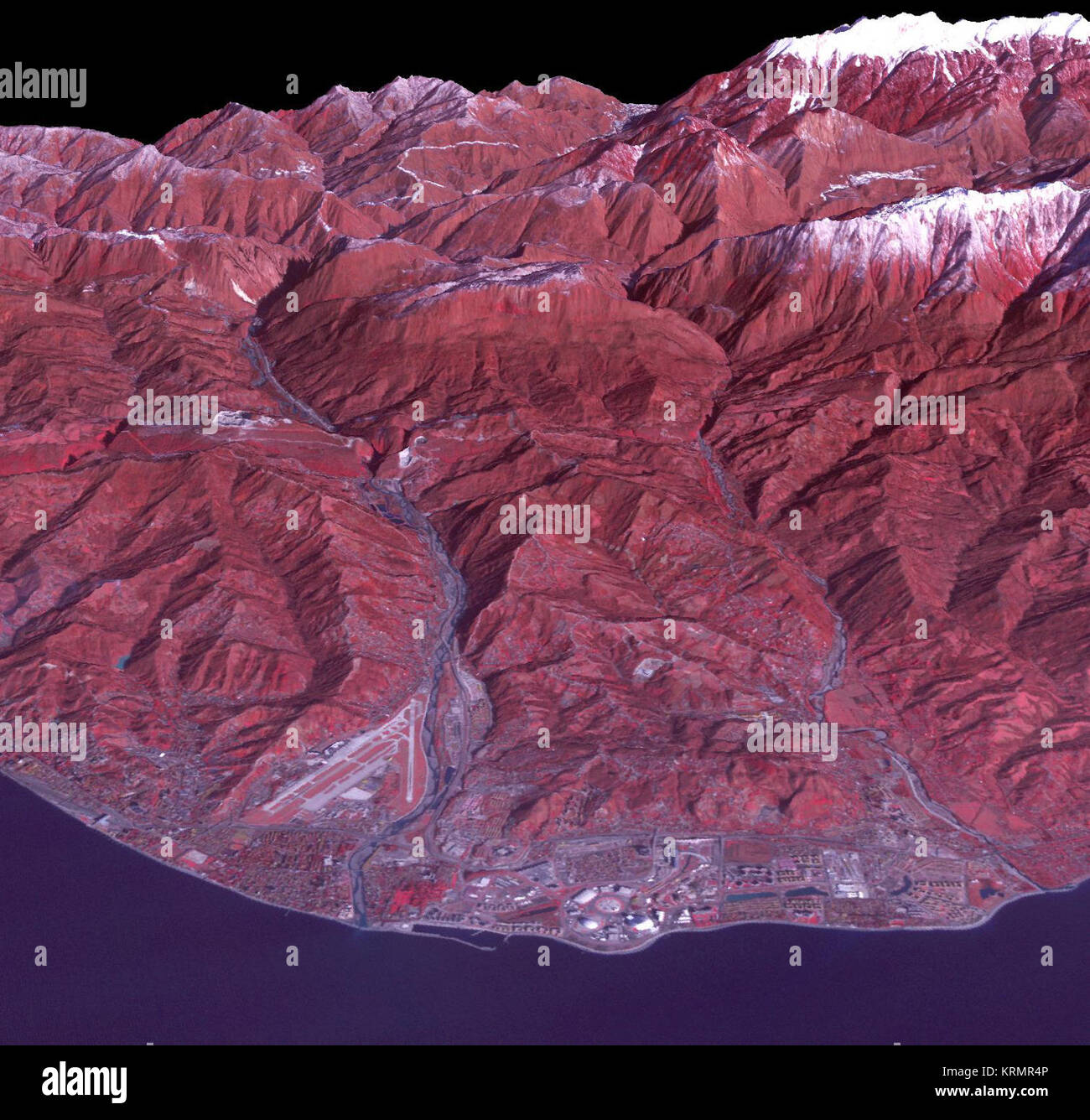 Sochi, Russia Winter Olympic Sites (Coastal Cluster)  The Black Sea resort of Sochi, Russia, is the warmest city ever to host the Winter Olympic Games, which open on Feb. 7, 2014, and run through Feb. 23. This north-looking image, acquired on Jan. 4, 2014, by the Advanced Spaceborne Thermal Emission and Reflection Radiometer (ASTER) instrument on NASA's Terra spacecraft, shows the Sochi Olympic Park Coastal Cluster -- the circular area on the shoreline in the bottom center of the image -- which was built for Olympic indoor sports. Even curling has its own arena alongside multiple arenas for ho Stock Photo