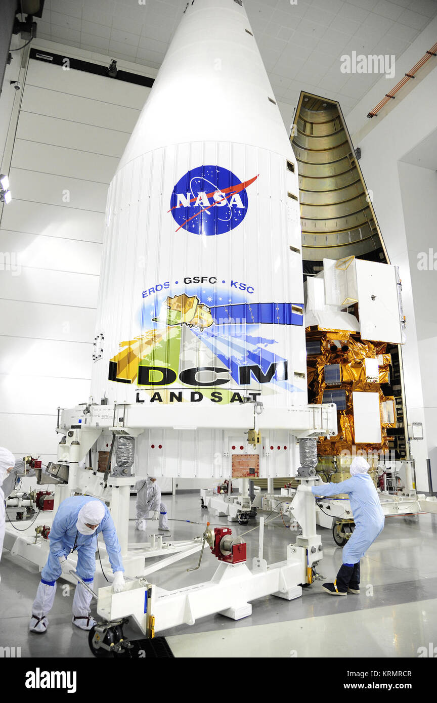 Jan. 23, 2013 Technicians encapsulate the NASA's Landsat Data Continuity Mission (LDCM) satellite in its payload fairing in the Astrotech processing facility at Vandenberg Air Force Base in California.  Image credit: NASA/VAFB  ---  Managers have given the 'go' to proceed toward a Feb. 11 launch of NASA's Landsat Data Continuity Mission (LDCM) spacecraft atop a United Launch Alliance Atlas V rocket from Vandenberg Air Force Base in California.   The Landsat Data Continuity Mission (LDCM) is the future of Landsat satellites. It will continue to obtain valuable data and imagery to be used in agr Stock Photo