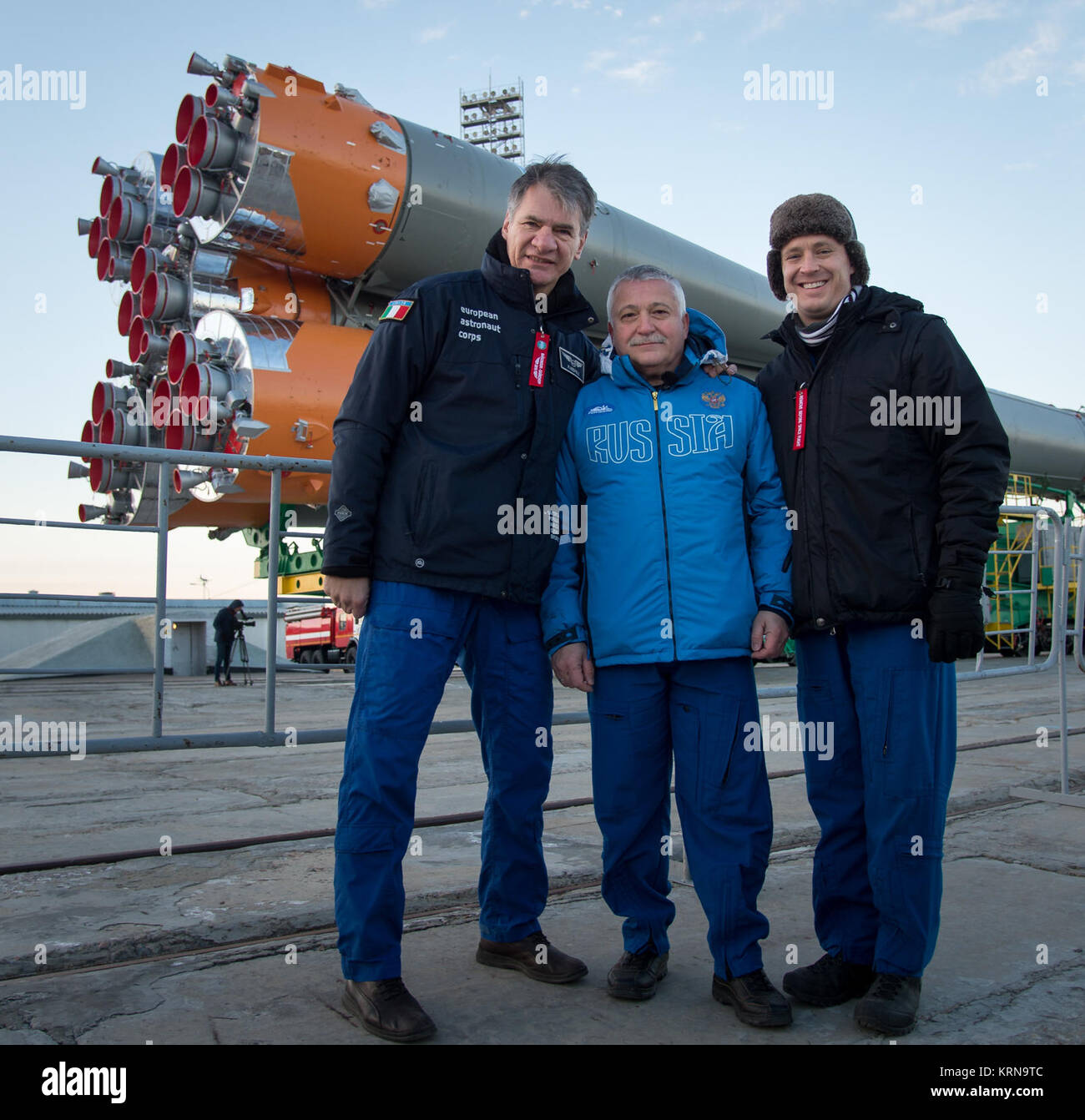 Expedition 50 backup crew members ESA astronaut Paolo Nespoli, left, Russian cosmonaut Fyodor Yurchikhin of Roscosmos, center, and NASA astronaut Jack Fischer pose for a photograph as the Soyuz rocket is rolled out by train to the launch pad at the Baikonur Cosmodrome, Kazakhstan, Monday, Nov. 14, 2016. NASA astronaut Peggy Whitson, Russian cosmonaut Oleg Novitskiy of Roscosmos, and ESA astronaut Thomas Pesquet will launch from the Baikonur Cosmodrome in Kazakhstan the morning of November 18 (Kazakh time.) All three will spend approximately six months on the orbital complex. Photo Credit: (NAS Stock Photo