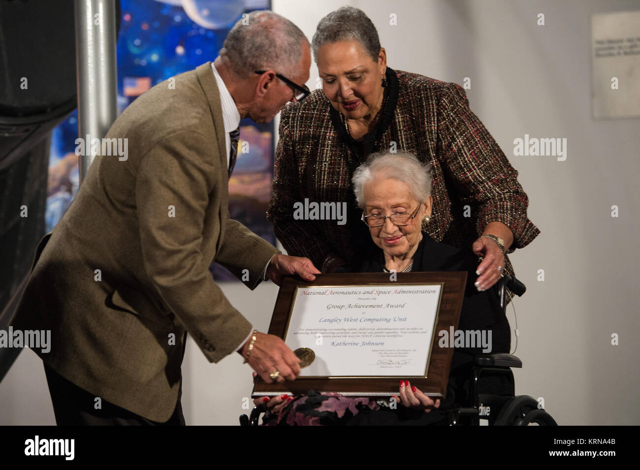 NASA Administrator Charles Bolden presents an award to Katherine Johnson, the African American mathematician, physicist, and space scientist, who calculated flight trajectories for John Glenn's first orbital flight in 1962, at a reception to honor members of the segregated West Area Computers division of Langley Research Center on Thursday, Dec. 1, 2016, at the Virginia Air and Space Center in Hampton, VA. Afterward, the guests attended a premiere of 'Hidden Figures' a film which stars Taraji P. Henson as Katherine Johnson, Octavia Spencer as Dorothy Vaughan, and Janelle Monae as Mary Jackson. Stock Photo