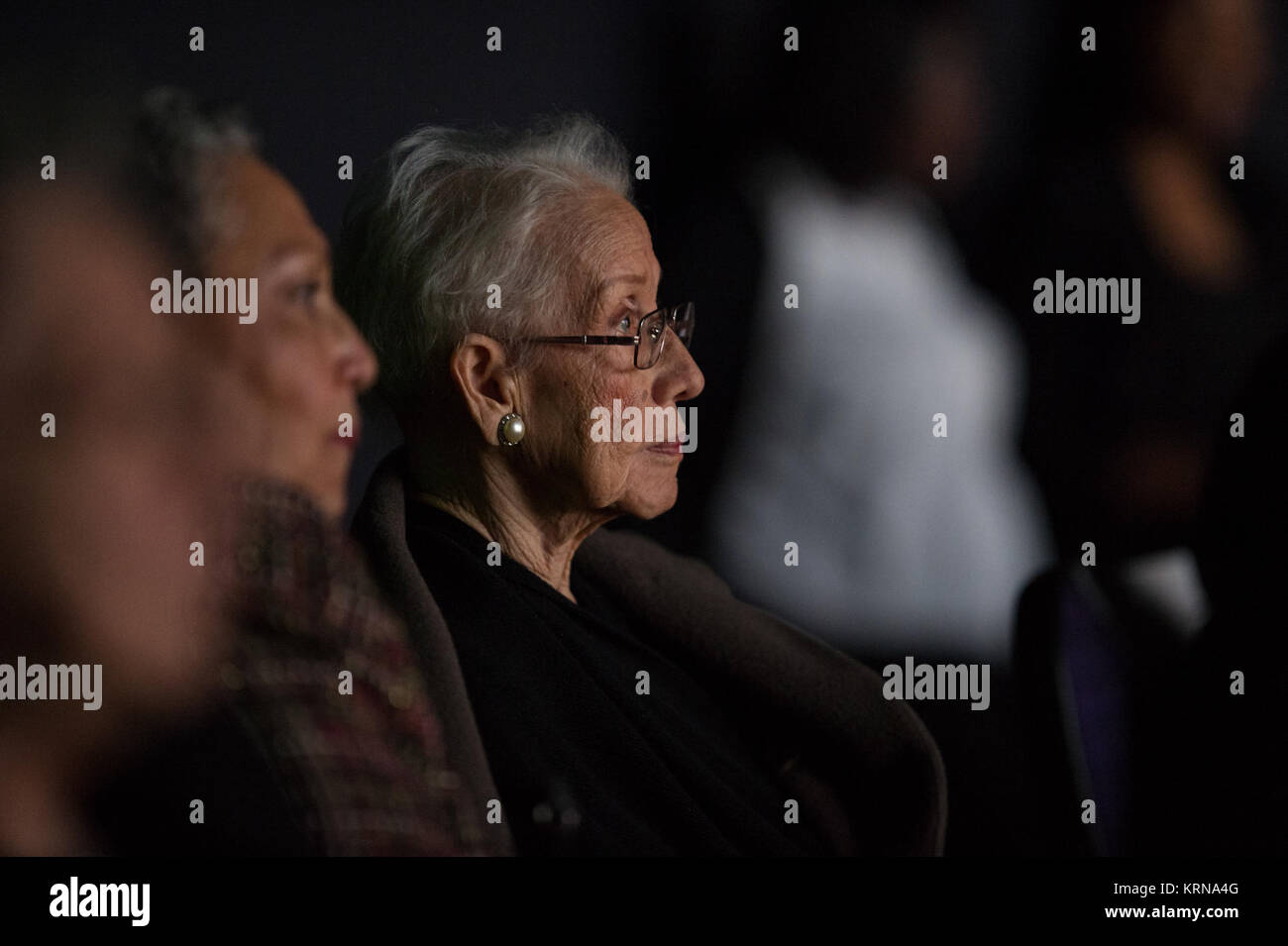 NASA 'human computer' Katherine Johnson watches the premiere of 'Hidden Figures' after a reception where she was honored along with other members of the segregated West Area Computers division of Langley Research Center, on Thursday, Dec. 1, 2016, at the Virginia Air and Space Center in Hampton, VA. 'Hidden Figures' stars Taraji P. Henson as Katherine Johnson, the African American mathematician, physicist, and space scientist, who calculated flight trajectories for John Glenn's first orbital flight in 1962. Photo Credit: (NASA/Aubrey Gemignani) Hidden Figures Premiere (NHQ201612010035) Stock Photo
