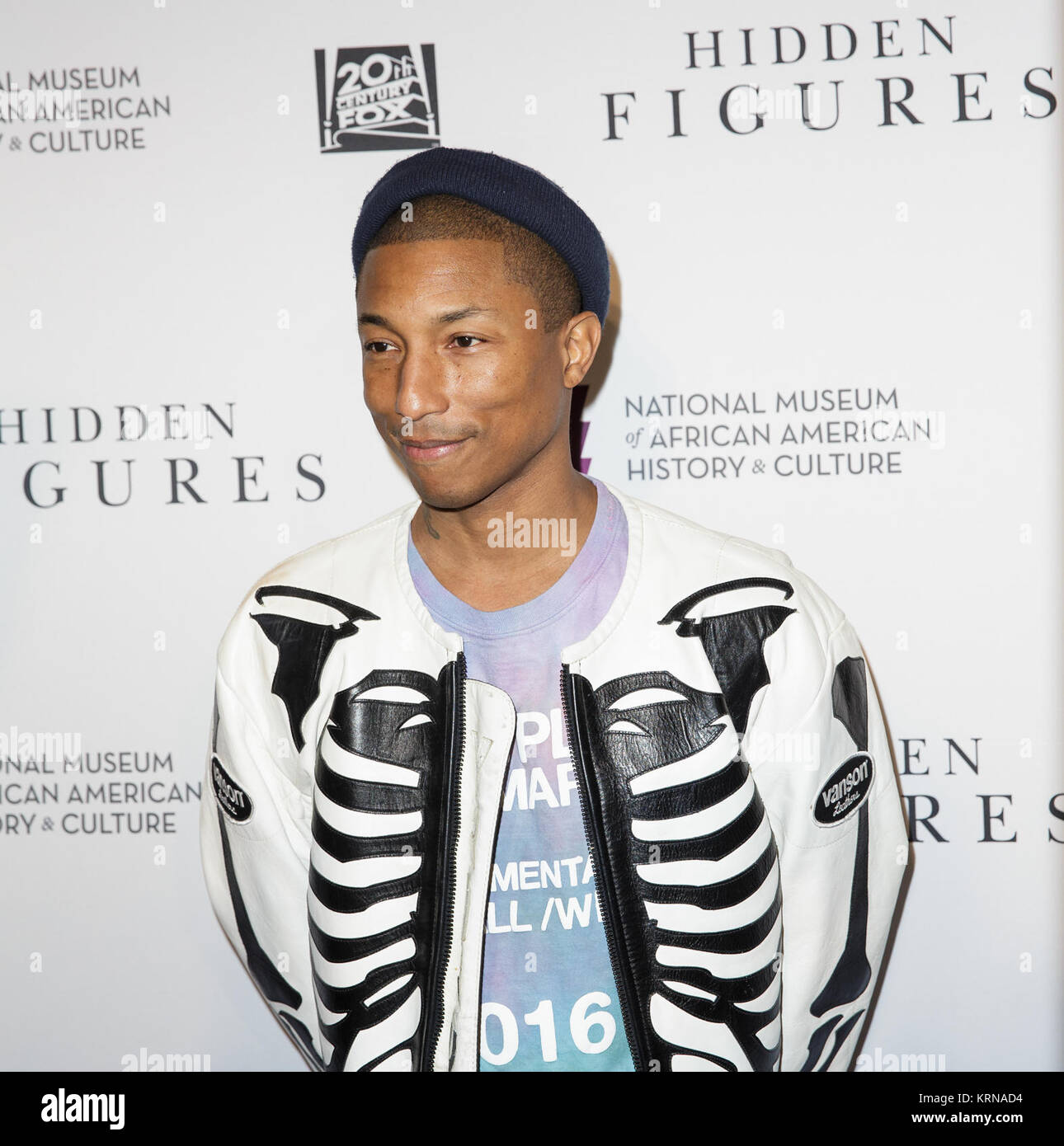American singer-songwriter Pharrell Williams arrives on the red carpet for a screening of the film “Hidden Figures” at the Smithsonian’s National Museum of African American History and Culture, Wednesday, Dec. 14, 2016 in Washington DC. The film is based on the book of the same title, by Margot Lee Shetterly, and chronicles the lives of Katherine Johnson, Dorothy Vaughan and Mary Jackson -- African-American women working at NASA as “human computers,” who were critical to the success of John Glenn’s Friendship 7 mission in 1962. Photo Credit: (NASA/Joel Kowsky) 22Hidden Figures22 Screening at N Stock Photo