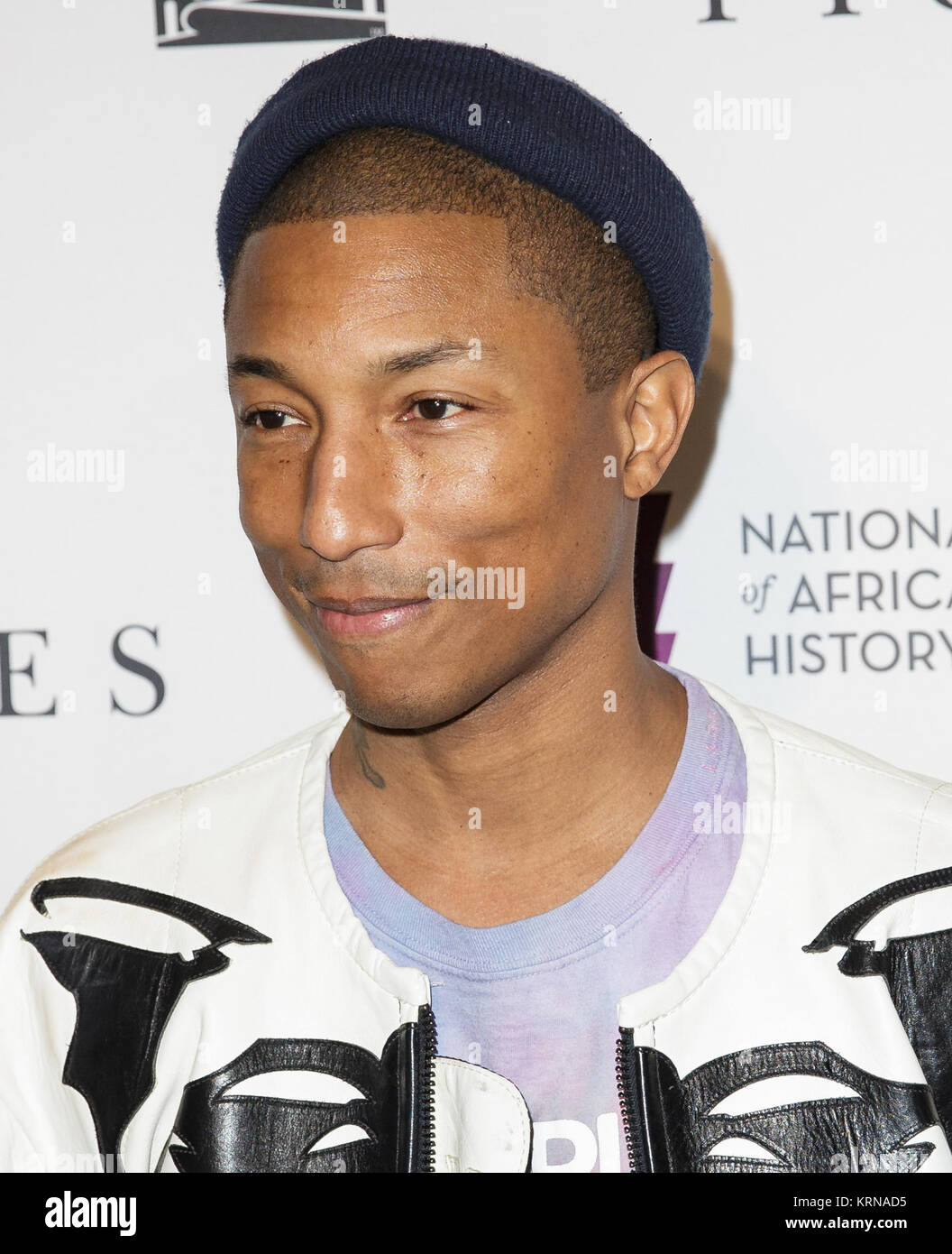 American singer-songwriter Pharrell Williams arrives on the red carpet for a screening of the film “Hidden Figures” at the Smithsonian’s National Museum of African American History and Culture, Wednesday, Dec. 14, 2016 in Washington DC. The film is based on the book of the same title, by Margot Lee Shetterly, and chronicles the lives of Katherine Johnson, Dorothy Vaughan and Mary Jackson -- African-American women working at NASA as “human computers,” who were critical to the success of John Glenn’s Friendship 7 mission in 1962. Photo Credit: (NASA/Joel Kowsky) 22Hidden Figures22 Screening at N Stock Photo