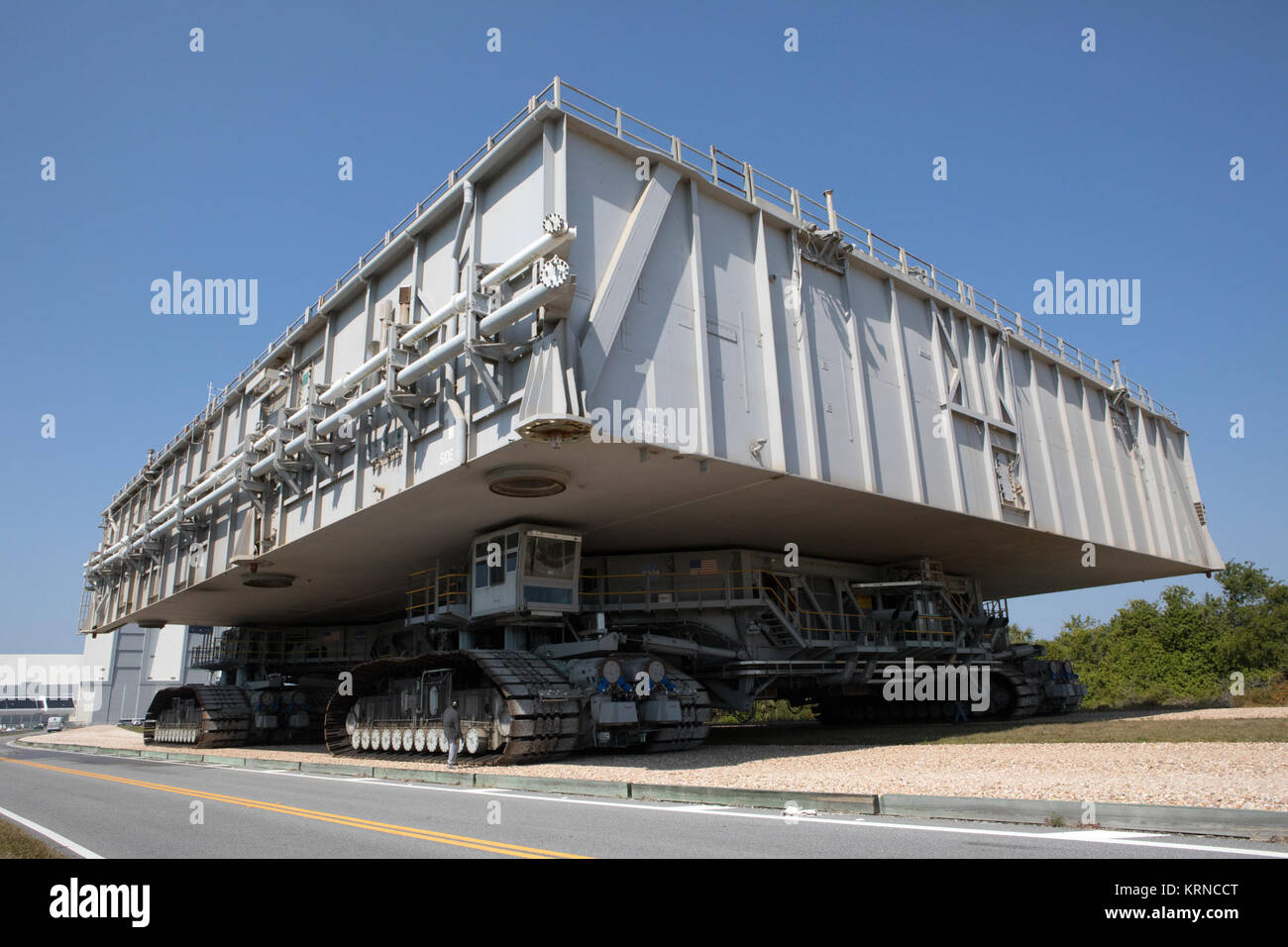NASA's upgraded crawler-transporter 2 (CT-2), carrying mobile launcher platform 1, moves slowly along the crawlerway toward the Vehicle Assembly Building at the agency's Kennedy Space Center in Florida. The crawler's upgrades and modifications were monitored and tested during a loaded test to the crawlerway Pad A/B split. CT-2 will return to the crawler yard. The crawler is being tested to confirm it is ready to support the load of the mobile launcher carrying the Space Launch System with Orion atop for the first test flight, Exploration Mission 1. The Ground Systems Development and Operations Stock Photo