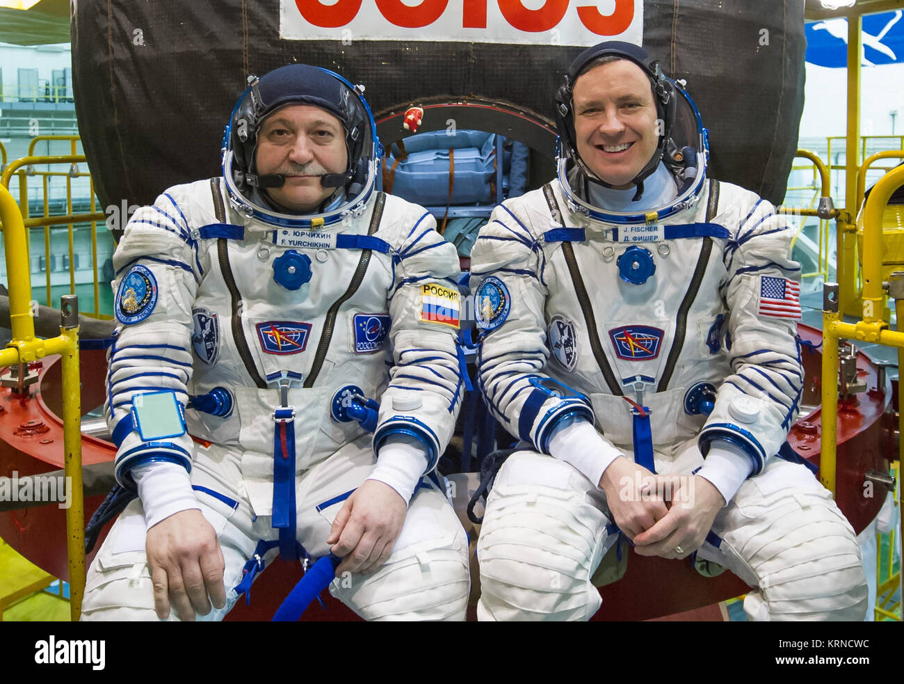 09-35-49:  In the Integration Building at the Baikonur Cosmodrome in Kazakhstan, Expedition 51 crewmembers Fyodor Yurchikhin of the Russian Federal Space Agency (Roscosmos, left) and Jack Fischer of NASA (right) pose for pictures April 6 in front of their Soyuz MS-04 spacecraft as part of pre-launch training preparations. Fischer and Yurchikhin will launch April 20 on the Soyuz MS-04 spacecraft for a four and a half month mission on the International Space Station.  NASA/Gagarin Cosmonaut Training Center/Andrey Shelepin Soyuz MS-04 crew in front of their spacecraft Stock Photo