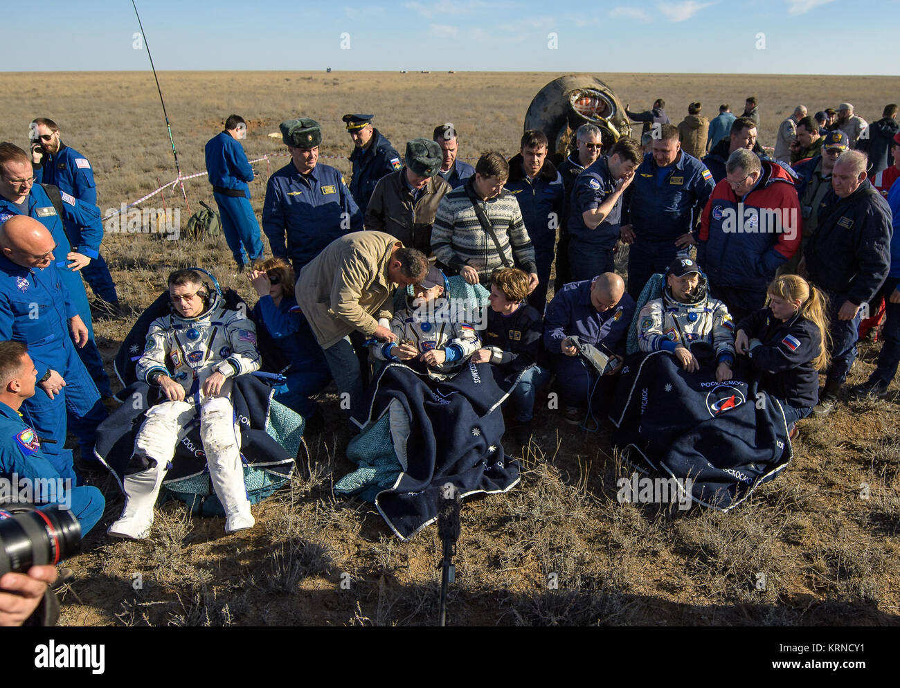 NASA astronaut Shane Kimbrough, left, Russian cosmonaut Sergey Ryzhikov of Roscosmos, center, and Russian cosmonaut Andrey Borisenko of Roscosmos sit in chairs outside the Soyuz MS-02 spacecraft a few moments after they landed in a remote area near the town of Zhezkazgan, Kazakhstan on Monday, April 10, 2017 (Kazakh time).  Kimbrough, Ryzhikov, and Borisenko are returning after 173 days in space where they served as members of the Expedition 49 and 50 crews onboard the International Space Station. Photo Credit: (NASA/Bill Ingalls) Expedition 50 Soyuz MS-02 Landing (NHQ201704100002) Stock Photo