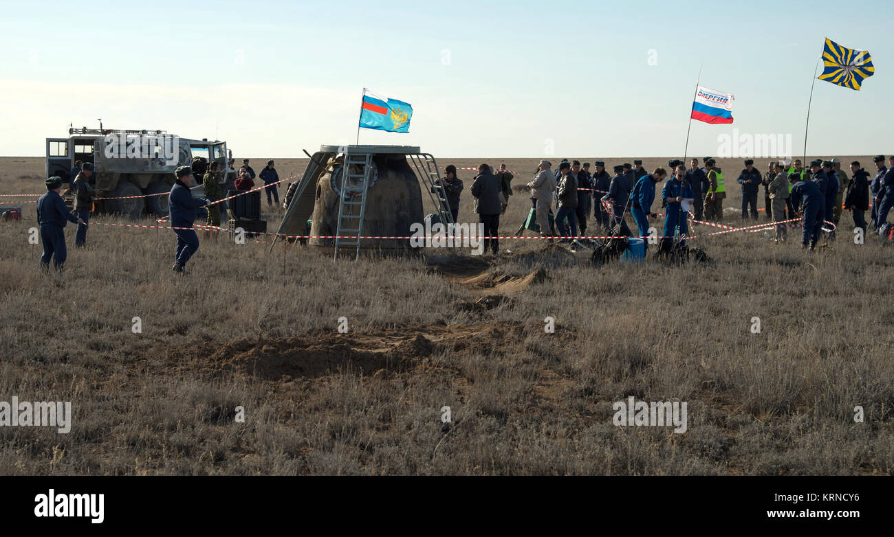 Russian support personnel work around the Soyuz MS-02 spacecraft shortly after it landed with Expedition 50 Commander Shane Kimbrough of NASA and Flight Engineers Sergey Ryzhikov and Andrey Borisenko of Roscosmos near the town of Zhezkazgan, Kazakhstan on Monday, April 10, 2017 (Kazakh time). Kimbrough, Ryzhikov, and Borisenko are returning after 173 days in space where they served as members of the Expedition 49 and 50 crews onboard the International Space Station. Photo Credit: (NASA/Bill Ingalls) Expedition 50 Soyuz MS-02 Landing (NHQ201704100039) Stock Photo