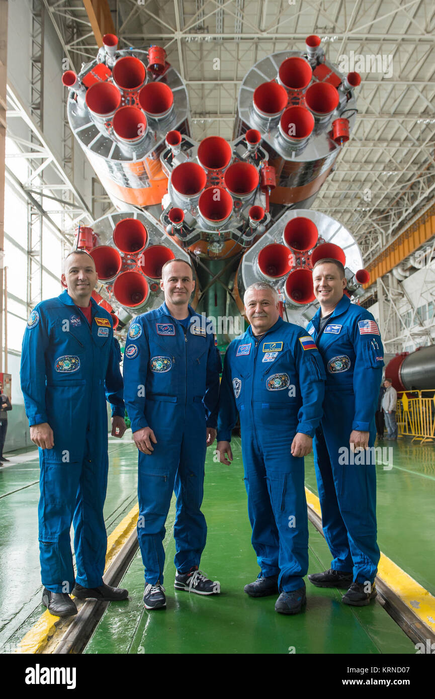 In the Integration Facility at the Baikonur Cosmodrome in Kazakhstan, the Expedition 51 prime and backup crewmembers pose for pictures April 14 in front of their Soyuz booster rocket. From left to right are backup crewmembers Randy Bresnik of NASA and Sergey Ryazanskiy of the Russian Federal Space Agency (Roscosmos) and prime crewmembers Fyodor Yurchikhin of Roscosmos and Jack Fischer of NASA.  Fischer and Yurchikhin will launch April 20 on the Soyuz MS-04 spacecraft for a four and a half month mission on the International Space Station.  NASA/Gagarin Cosmonaut Training Center/Andrey Shelepin  Stock Photo