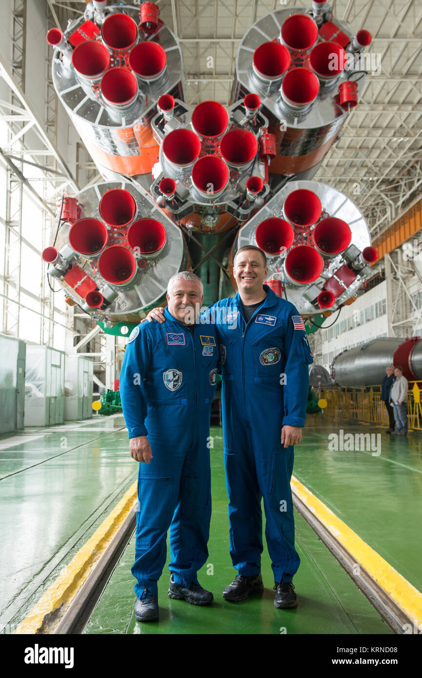 In the Integration Facility at the Baikonur Cosmodrome in Kazakhstan, Expedition 51 crewmembers Fyodor Yurchikhin of the Russian Federal Space Agency (Roscosmos, left) and Jack Fischer of NASA (right) pose for pictures April 14 in front of their Soyuz booster rocket. Fischer and Yurchikhin will launch April 20 on the Soyuz MS-04 spacecraft for a four and a half month mission on the International Space Station.  NASA/Gagarin Cosmonaut Training Center/Andrey Shelepin Soyuz MS-04 crew in front of their booster rocket Stock Photo
