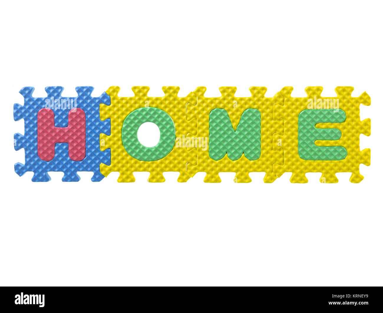 foam puzzle forming word home Stock Photo