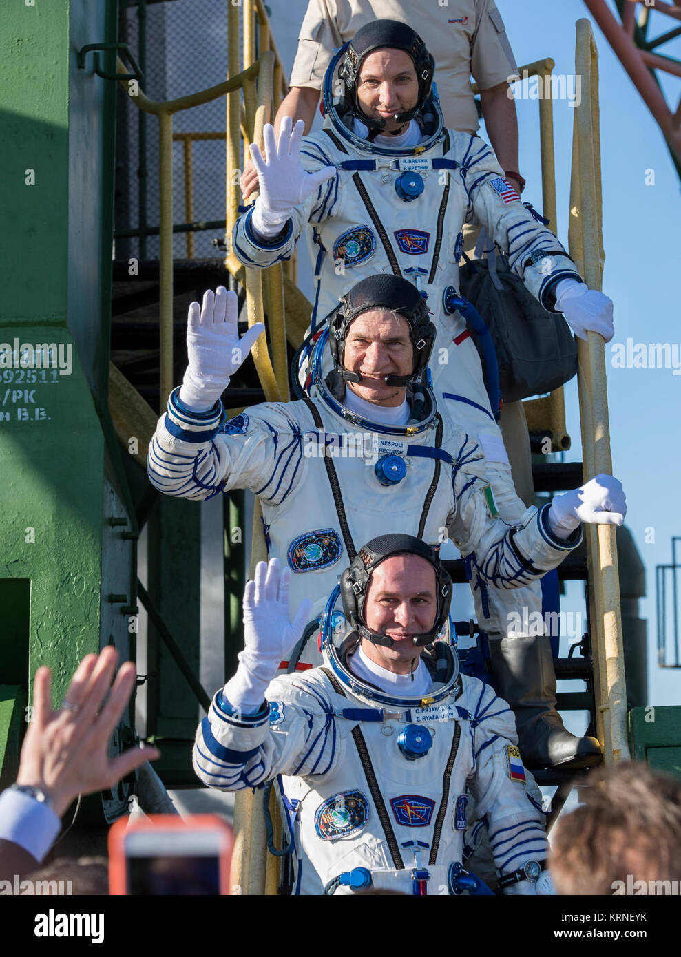 Expedition 52 flight engineer Randy Bresnik of NASA, top, flight engineer Paolo Nespoli of ESA (European Space Agency), middle, and flight engineer Sergei Ryazanskiy of Roscosmos, bottom, wave farewell prior to boarding the Soyuz MS-05 rocket for launch, Friday, July 28, 2017 at the Baikonur Cosmodrome in Kazakhstan.  Ryazanskiy, Bresnik, and Nespoli will spend the next four and a half months living and working aboard the International Space Station.  Photo Credit: (NASA/Joel Kowsky) Expedition 52 Preflight (NHQ201707280004) Stock Photo