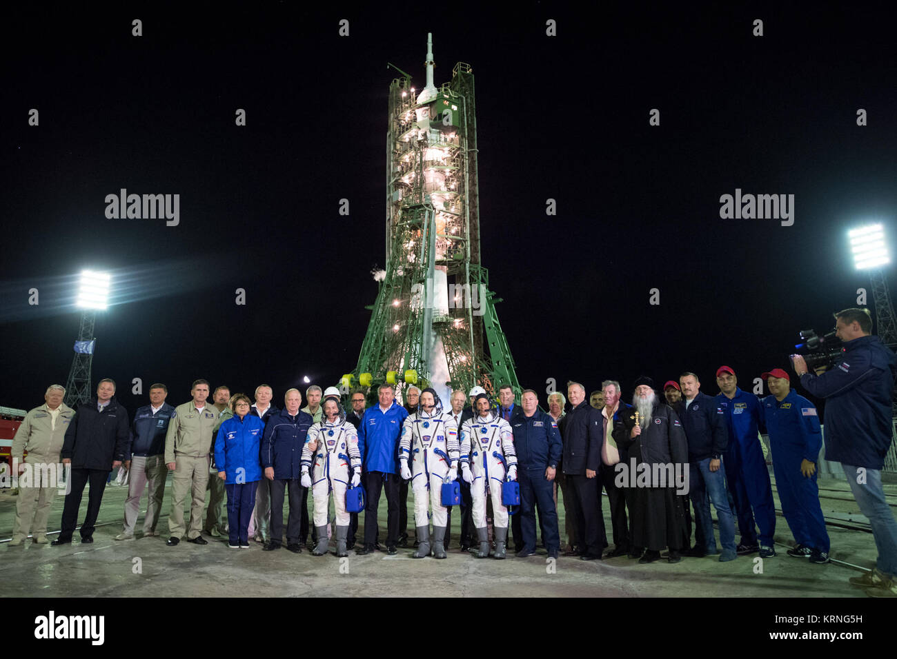 Expedition 53 crewmembers Mark Vande Hei of NASA, left, Alexander Misurkin of Roscosmos, and Joe Acaba of NASA right, pose for a group photograph with Roscosmos and NASA management after arriving at the Soyuz launch pad ahead for their launch, Wednesday, Sept. 13, 2017, (Sept. 12, U.S. time). Acaba, Misurkin, and Vande Hei will spend approximately five and half months on the International Space Station. Photo Credit: (NASA/Bill Ingalls) Expedition 53 Soyuz Launch (NHQ201709130014) Stock Photo