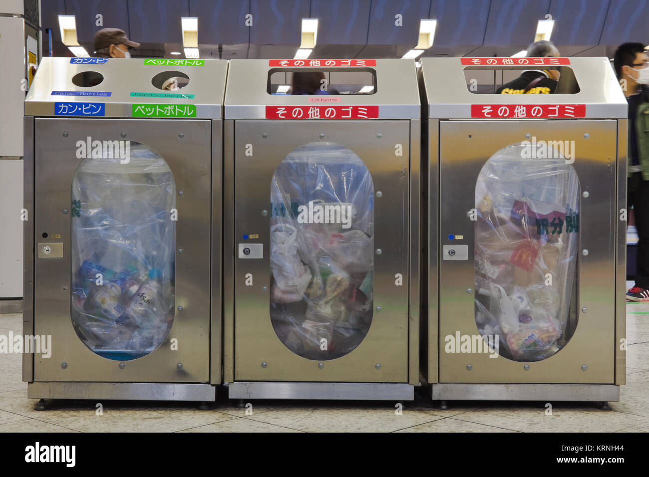 Trash bins in public area provided by city which every household is required to separate and get