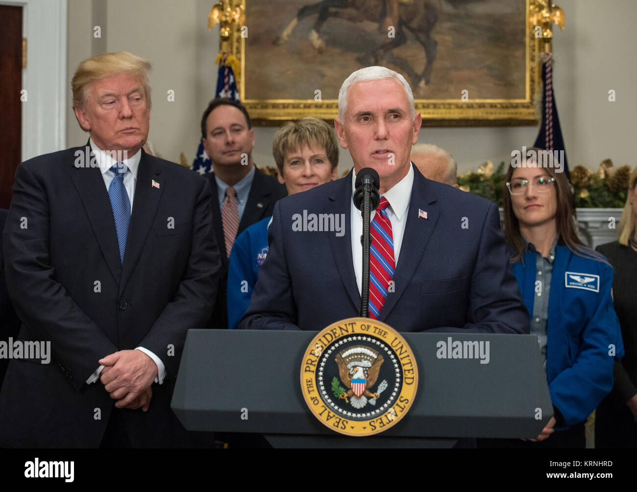 Vice President Mike Pence speaks before President Donald Trump signs the Presidential Space Directive - 1, directing NASA to return to the moon, alongside President Donald Trump. left, Acting NASA Administrator Robert Lightfoot, second left, NASA astronaut Peggy Whitson, third from left, NASA astronaut Christina Koch, right, and members of the Senate, Congress, and commercial space companies in the Roosevelt room of the White House in Washington, Monday, Dec. 11, 2017. Photo Credit: (NASA/Aubrey Gemignani) Presidential Space Directive - 1 Signing (NHQ201712110006) Stock Photo