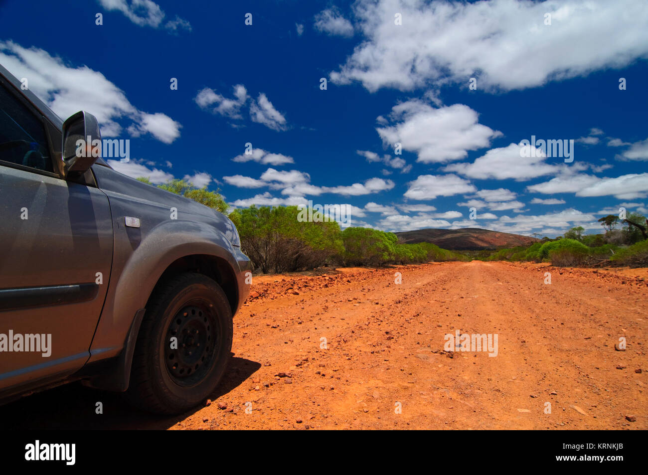 A Car on a Red Dirt Road in South Australian Outback, Gawler Ranges, South Australia (SA), Australia Stock Photo