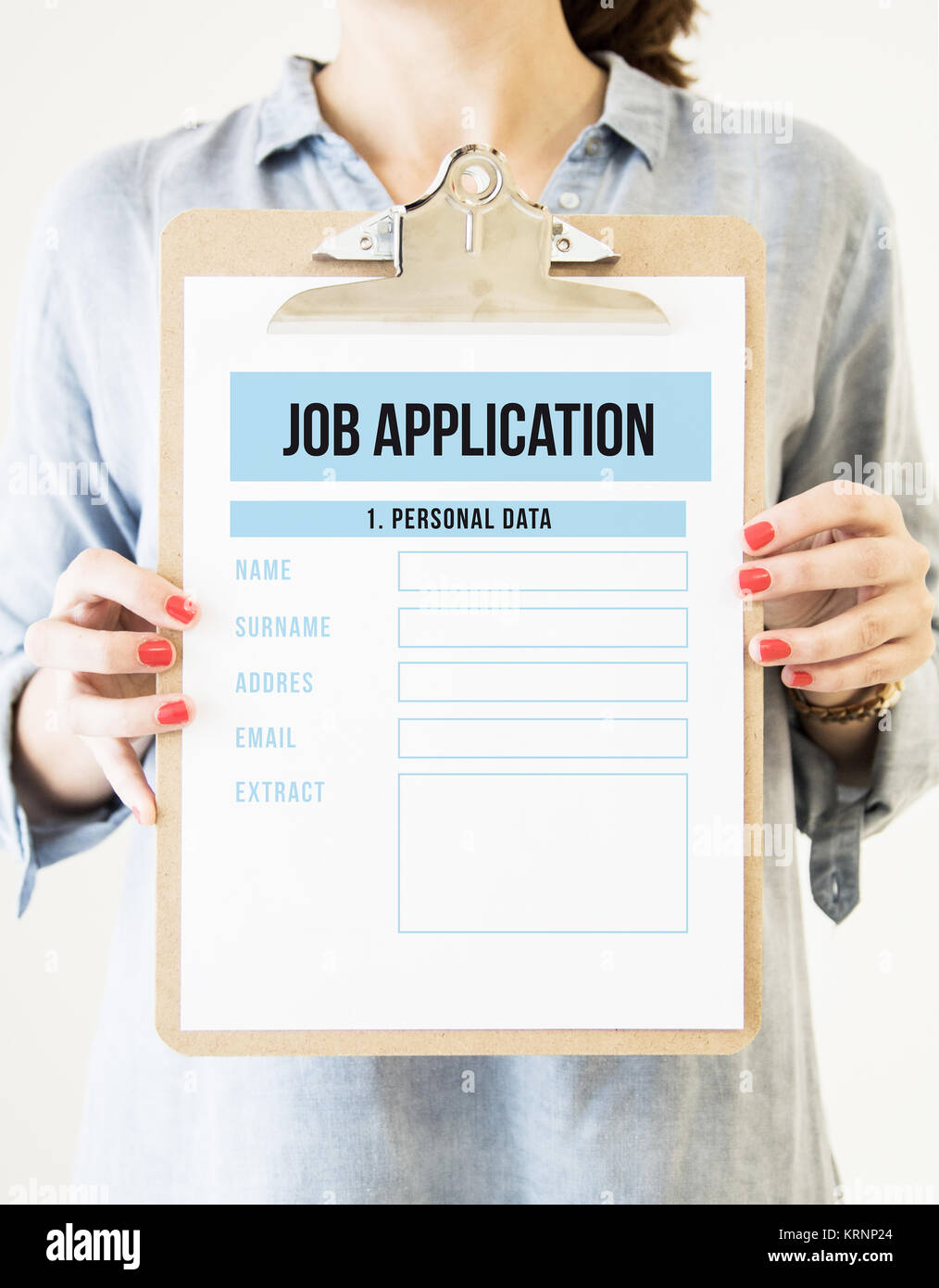 woman holding a clipboard with job application Stock Photo