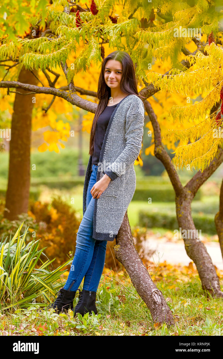 portrait of pretty teen girl in autumn park Stock Photo