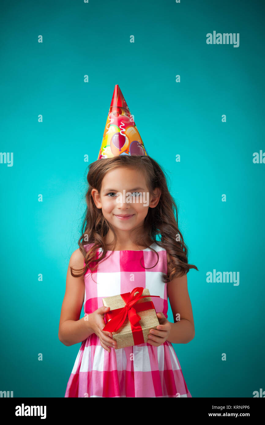 The cute cheerful little girl on blue background Stock Photo - Alamy