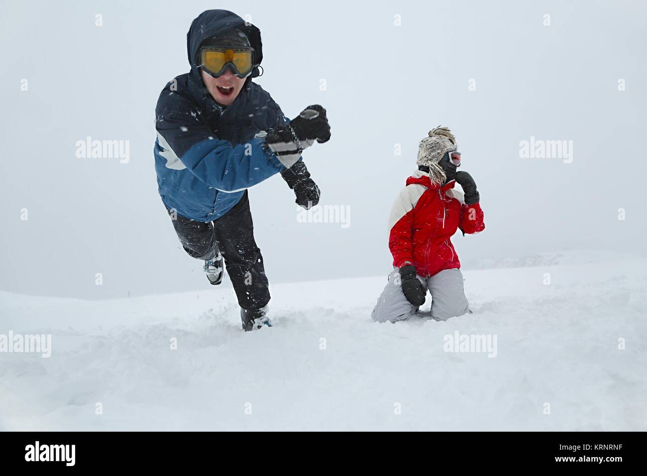 Skiers playing in the snow Stock Photo