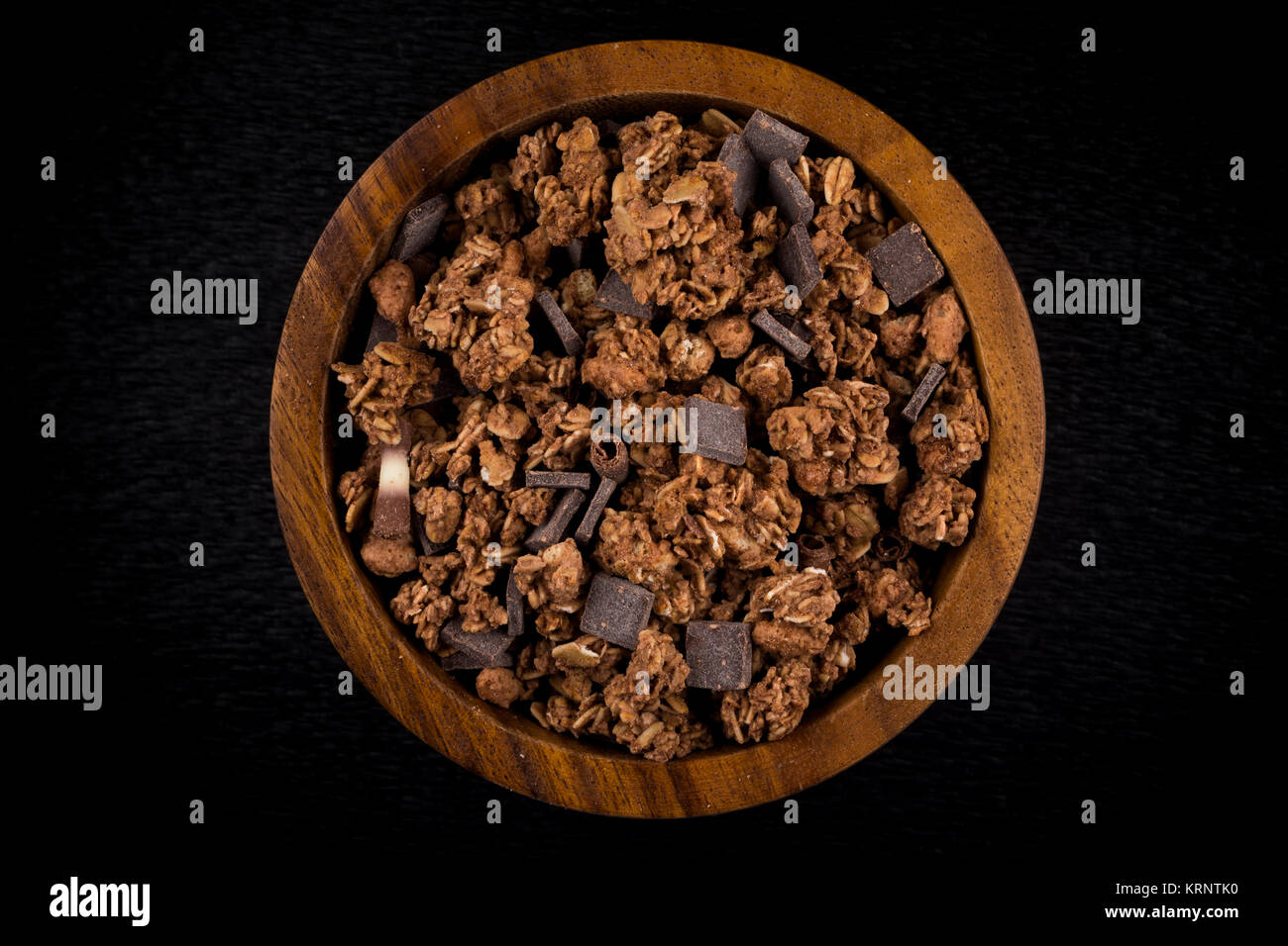 Close up of chocolate muesli with pieces of chocolate in a bowl on white  isolated background Stock Photo - Alamy
