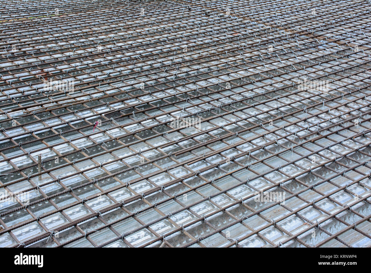 symmetrical pattern of iron bars in construction site Stock Photo Alamy