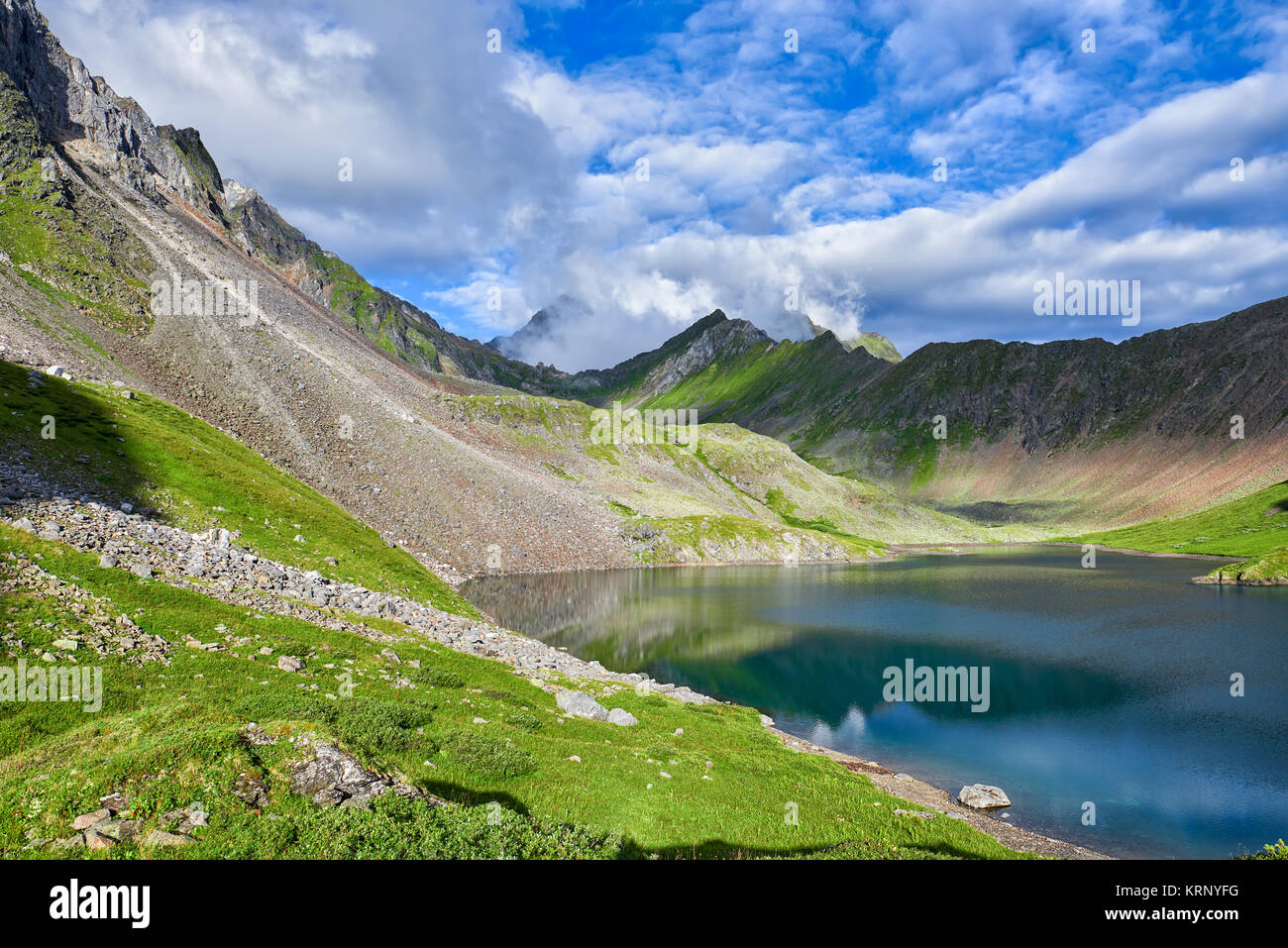 Summer day at mountain lake. Eastern Sayan. Southern Siberia. Russia Stock Photo