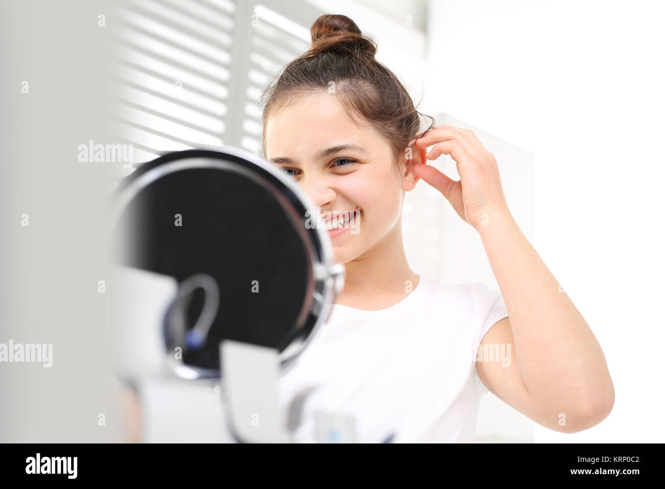 invisible hearing aid. the hearing aid for a child Stock Photo Alamy