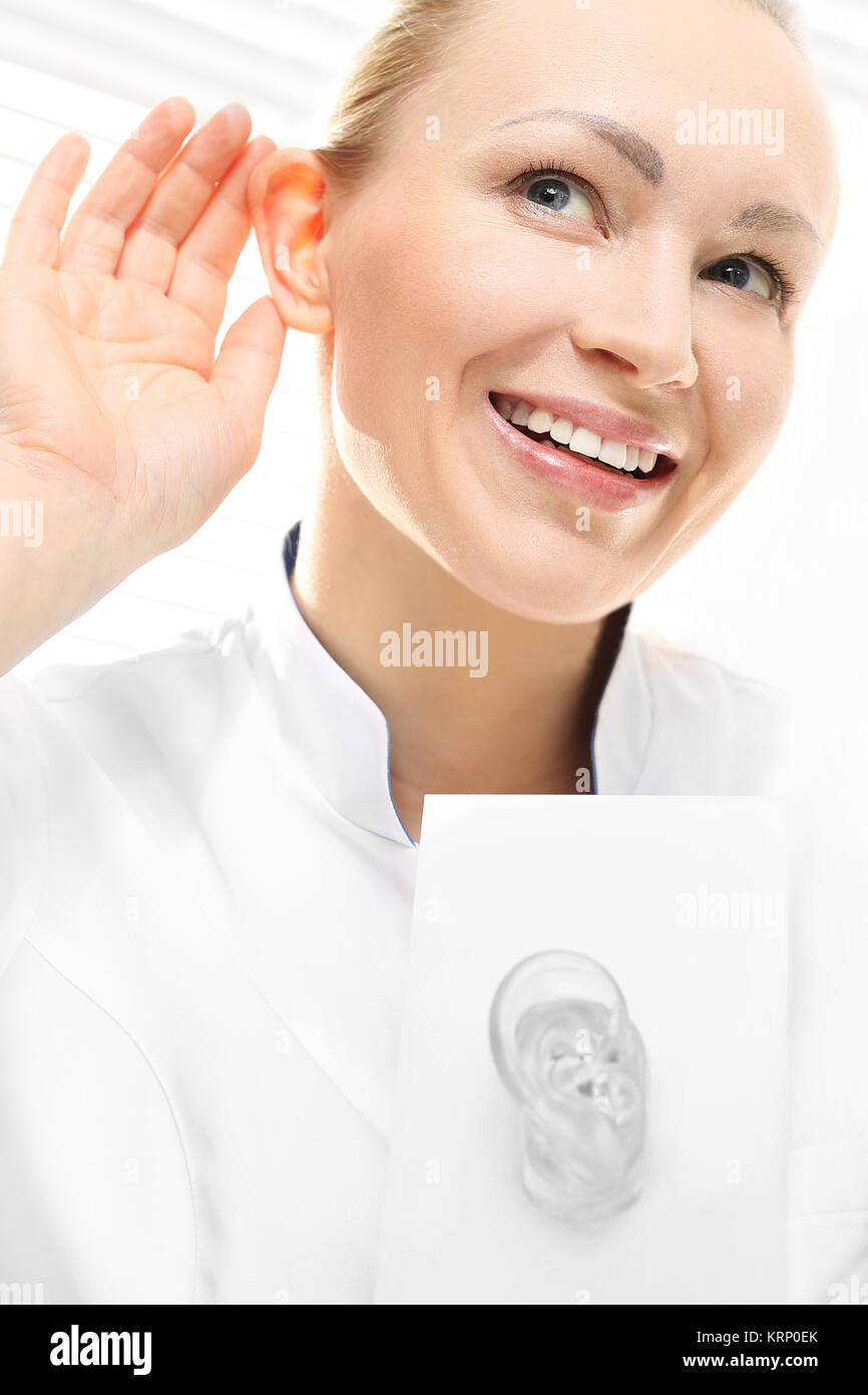 a woman listens to the sound. recovery of hearing. Stock Photo